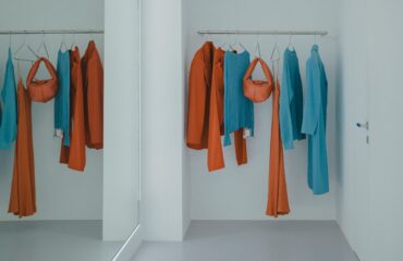 Fashionable store with clothes in blue and red colors.