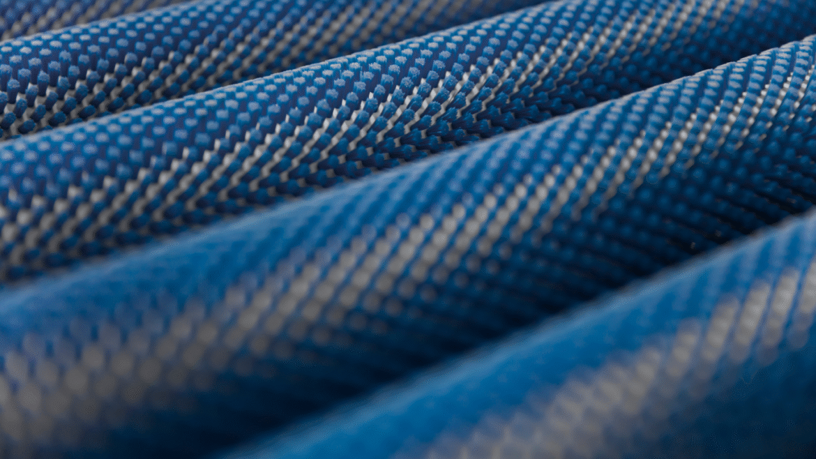 Circular knit fabric shown in tubular form beside the same fabric slit open to flat, open-width form