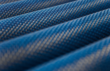 TUBULAR FABRIC CUTTING Circular knit fabric shown in tubular form beside the same fabric slit open to flat, open-width form